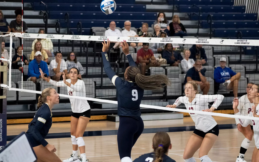 Erica Sledge setting in volleyball match 