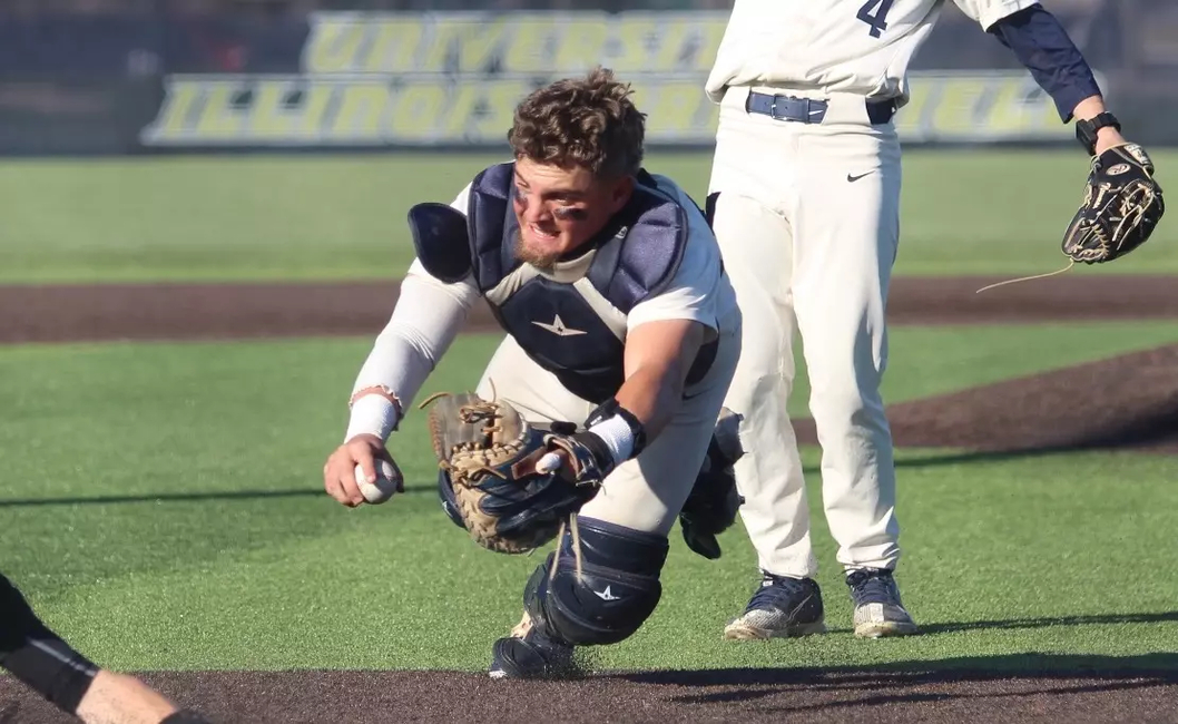 Ivan Dahlberg diving for the tag at home plate