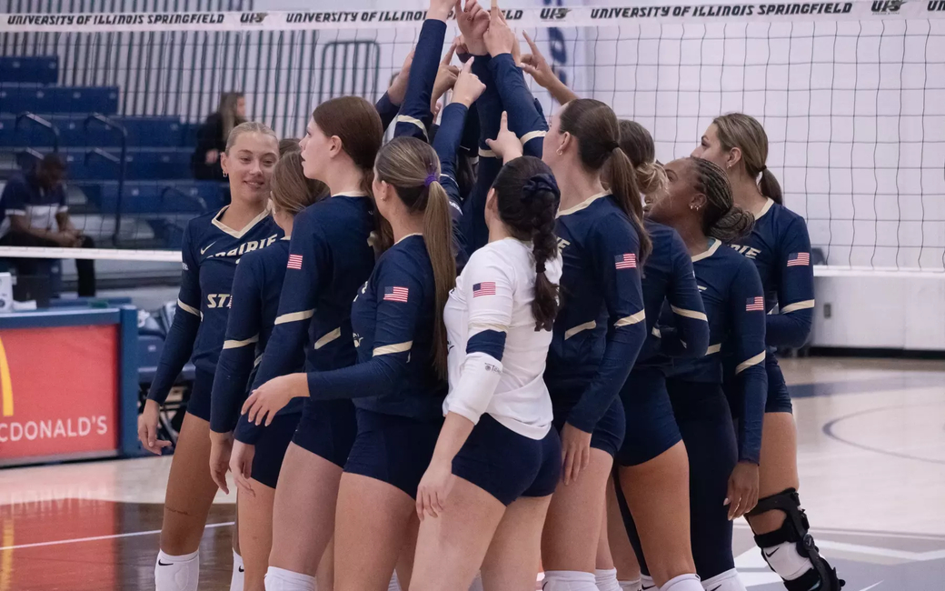 UIS volleyball team huddle