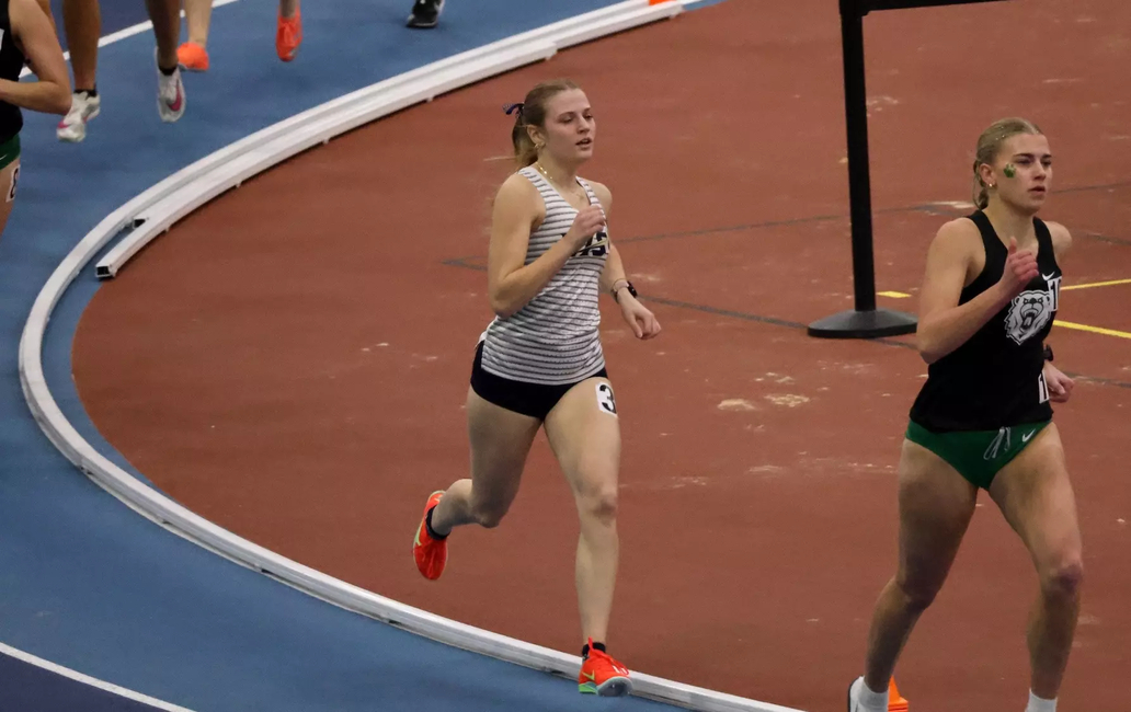 Norah Wright racing indoor track