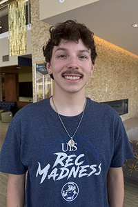 Joseph Russo smiling at the camera at the Student Union