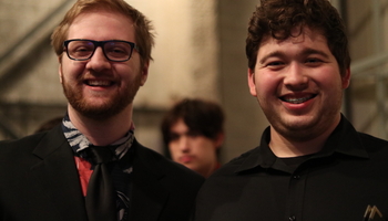 photograph of two student musicians smiling 