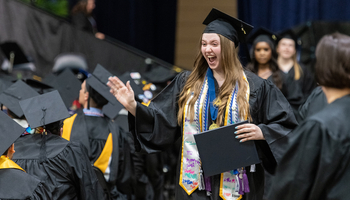 Grad in cap and gown