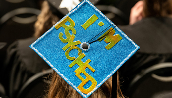 a graduation cap with the words "I'm psyched"