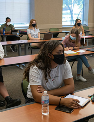 students in class with masks