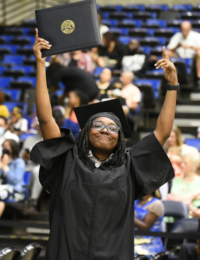 Grad holding diploma 