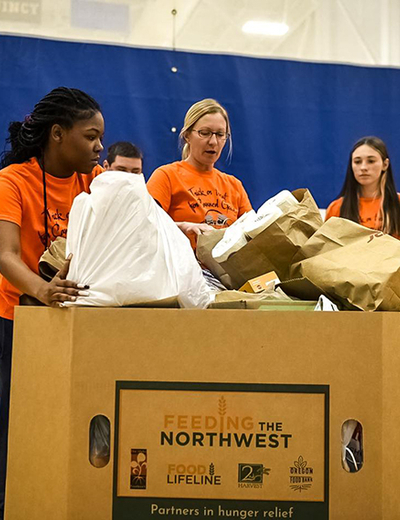 Students with a box of collected food