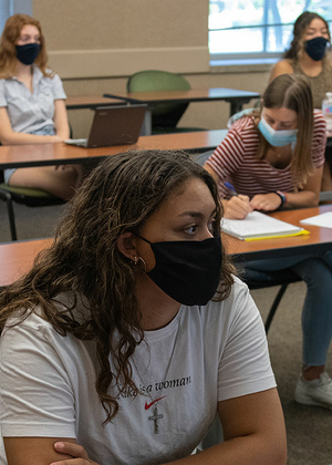 student in class with masks