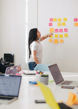 People in a boardroom doing a strategic planning exercise