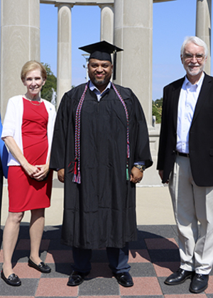 Interim Chancellor Karen Whitney, UIS Chancellor Emerita Susan Koch, graduate Christopher Holley and UI System President Timothy Killeen at the Sept. 18 commencement ceremony.