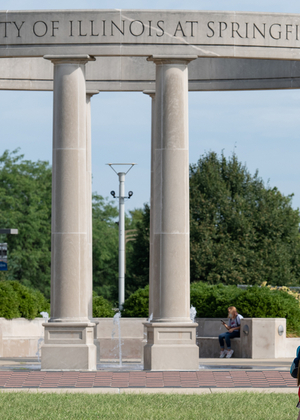 Students walk by UIS Colonnade