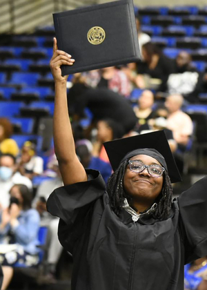 Grad holding diploma