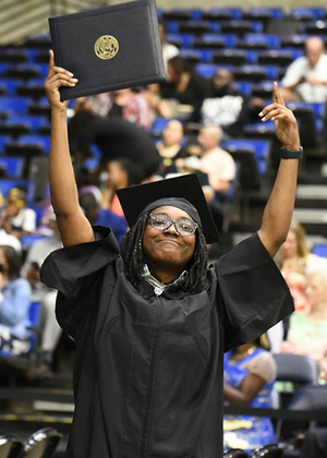 Grad holding diploma 