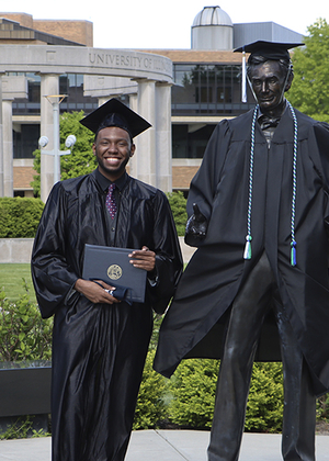 Graduate in gap and gown