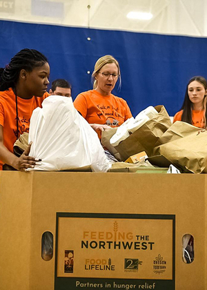 Students with a box of collected food