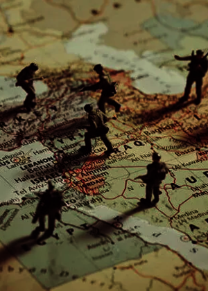 toy solders placed on a map of the Middle East