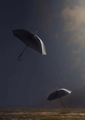 Umbrellas falling from the sky