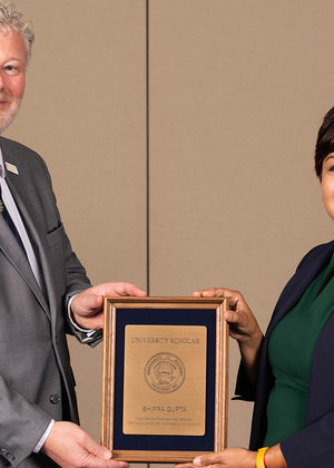 Shipra Gupta holding award