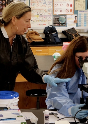 MLS student and professor in lab