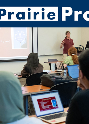 Photo of a UIS class with the Prairie Promise logo