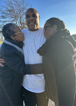 Brian Beals hugged by family members