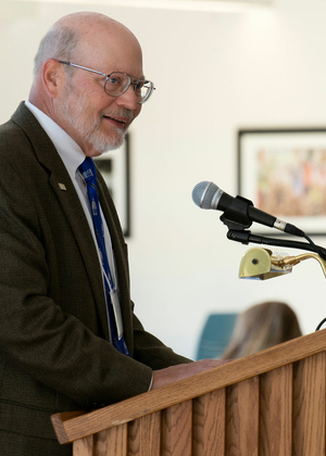 Ray Schroeder speaking at an event