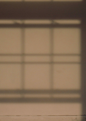 Artwork by Ruby Que that shows the shadow of a window on a wall