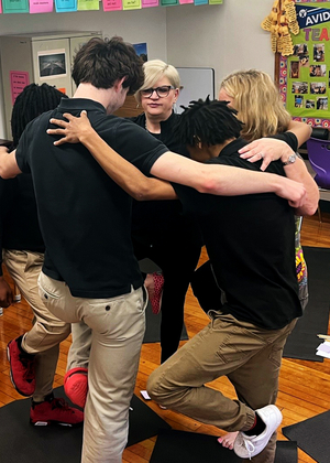 Jennifer Martin teaches students yoga