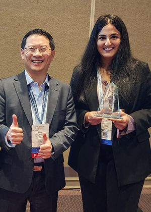 Brian Chen and Zainab Yaseen pose with the award.