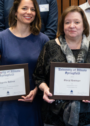 Drs. Bolivar and Reminger with their awards