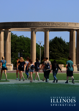 Students walk towards the colonnade.