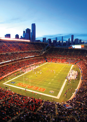 Football stadium at dusk with city skyline in background.