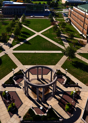 Aerial view of a campus courtyard with surrounding buildings.