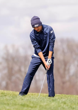 Sacha Lamraski golfing in blue UIS outfit