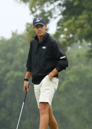 Julien Babineau golfing in rain