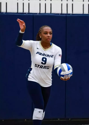 Erica Sledge prepares to serve