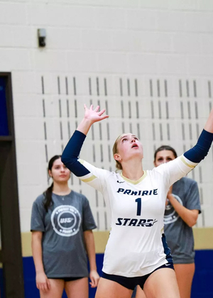 UIS volleyball player serves