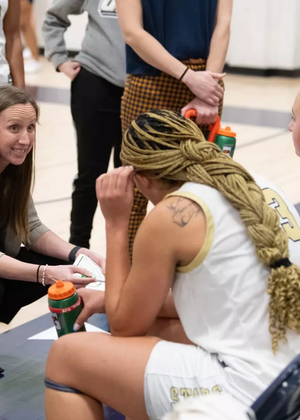 Olivia Lett coaching team during timeout