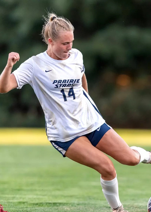 Addi Wittenberg playing soccer in white UIS uniform
