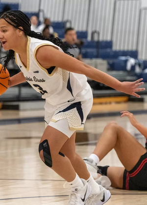 Kayla Rice coming off a steal in basketball game