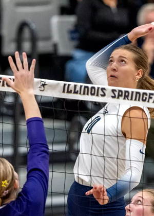 Alexis Schwartz goes up for a kill in volleyball match
