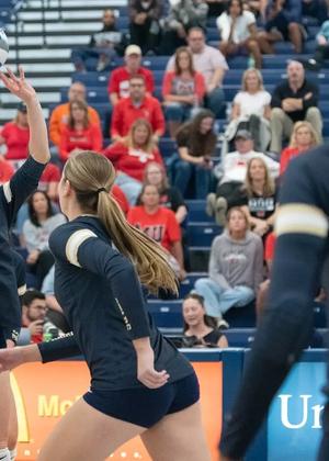 Anna Laincz sets Kendall Johnson up for an attack