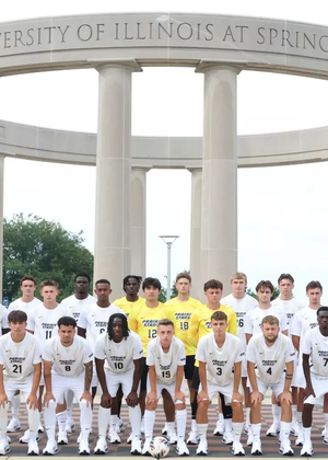 2026 UIS Men's Soccer team photo of student-athletes and coaches in front of the UIS Colonnade