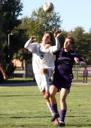 Robin Lemke Bergseth playing soccer in white UIS uniform