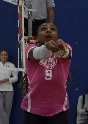 Erica Sledge playing volleyball