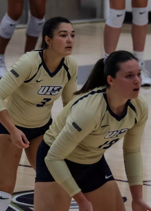 Bella Hodges and Makenna Cox await serve