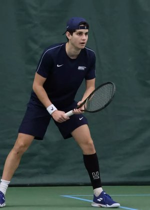 Jorge Roman playing tennis