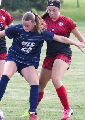 Elyse Severson playing soccer in UIS blue