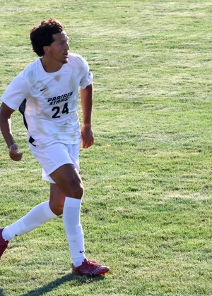 Donovan Faletto playing soccer in Prairie Stars white and gold