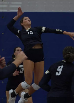 Carly Michels goes up for the kill